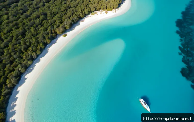 조르라 라군 - Photorealistic aerial view of a pristine turquoise lagoon with a crescent of white sand, shallow cor...